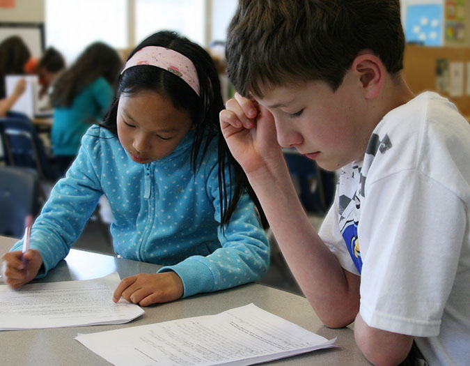 Students practicing focused independent writing during the WriteNow summer writing program